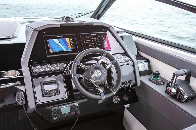 Slide: The Image of Manufacturer Provided Image: Helm of 2026 Cruisers Yachts 34 GLS I/O with advanced navigation displays. - 3