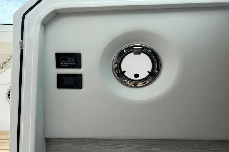 Slide: The Image of 2026 Cruisers Yachts 34 GLS I/O interior control panel and porthole detail. - 31