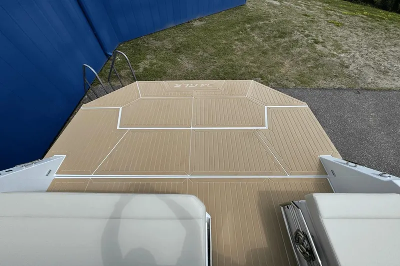 Slide: The Image of 2026 Cruisers Yachts 34 GLS I/O swim platform with ladder, beige decking. - 32