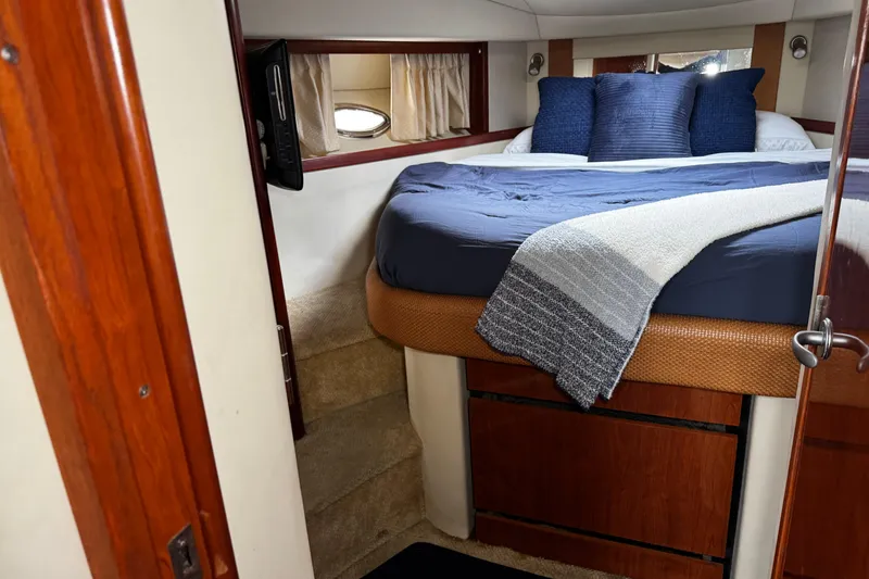 Slide: The Image of Luxurious cabin interior of 2006 Sea Ray 38 Sundancer yacht with cozy bedding. - 13