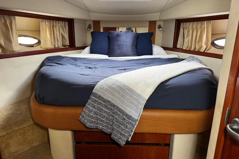 Slide: The Image of Luxurious cabin interior of 2006 Sea Ray 38 Sundancer yacht with cozy bedding. - 14