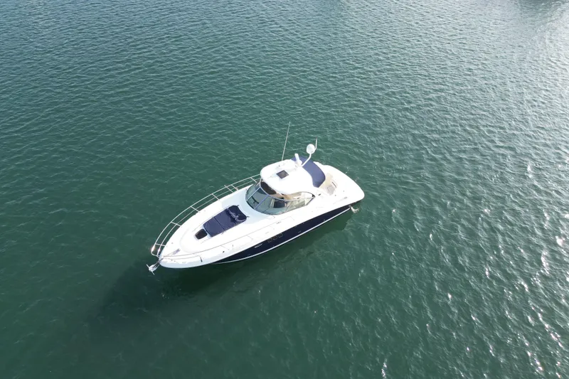 Slide: The Image of 2006 Sea Ray 38 Sundancer yacht cruising on open water. - 7