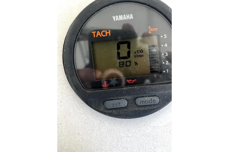 Slide: The Image of 2014 Sportsman Heritage 211 Center Console boat on trailer under shelter. - 10