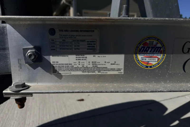 Slide: The Image of 2014 Sportsman Heritage 211 Center Console dashboard with compass and wiring. - 18