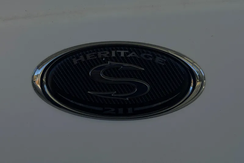Slide: The Image of Steering wheel of 2014 Sportsman Heritage 211 Center Console boat with gauges. - 19