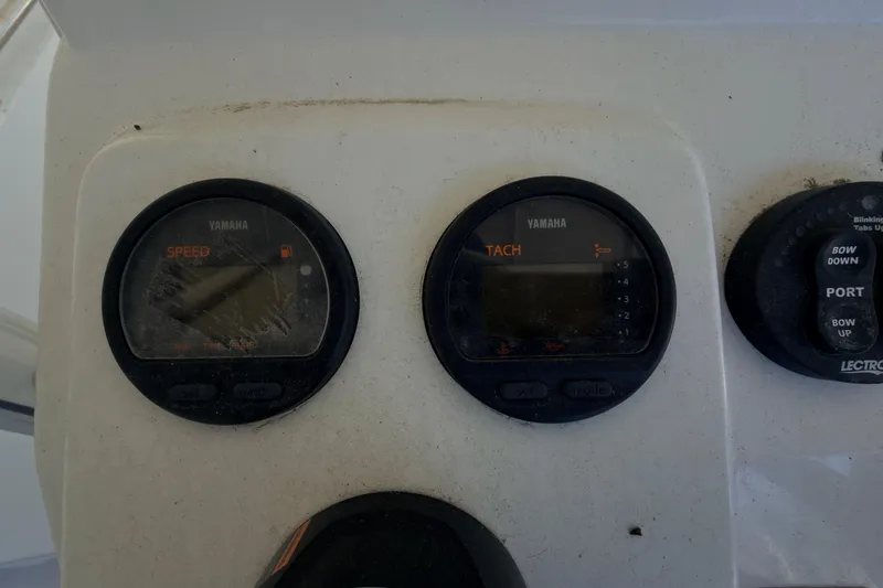 Slide: The Image of Yamaha speed and tachometer gauges on 2014 Sportsman Heritage 211 Center Console boat. - 20