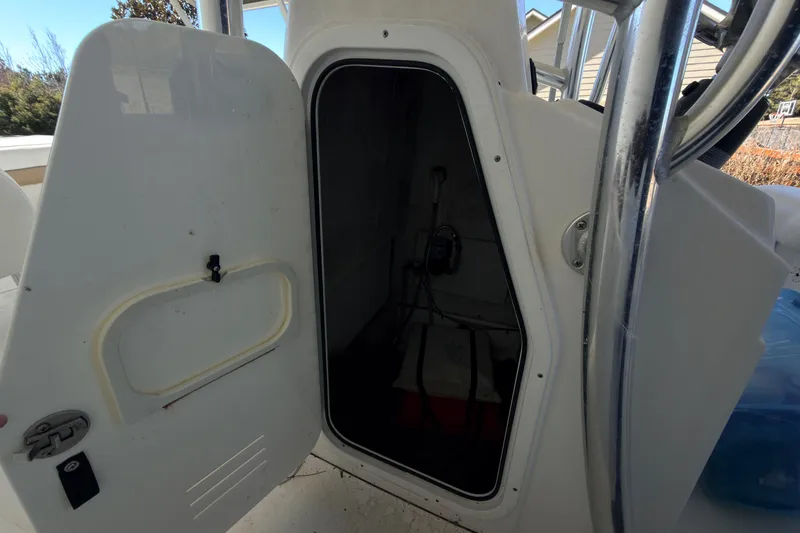 Slide: The Image of Control panel of 2014 Sportsman Heritage 211 Center Console boat with switches and radio. - 22