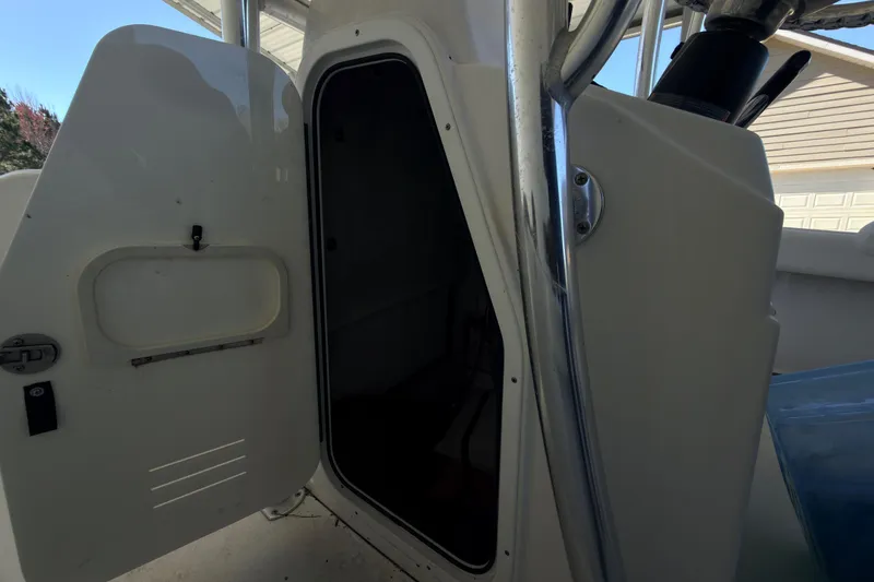 Slide: The Image of 2014 Sportsman Heritage 211 Center Console interior with storage compartments and seating. - 23