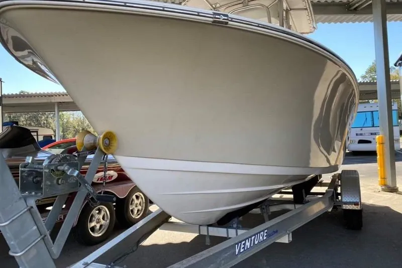 Slide: The Image of 2014 Sportsman Heritage 211 Center Console with Yamaha outboard motor in storage. - 3