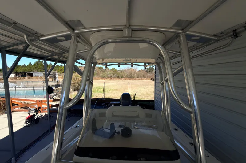 Slide: The Image of 2014 Sportsman Heritage 211 Center Console boat interior with steering wheel and seating. - 38