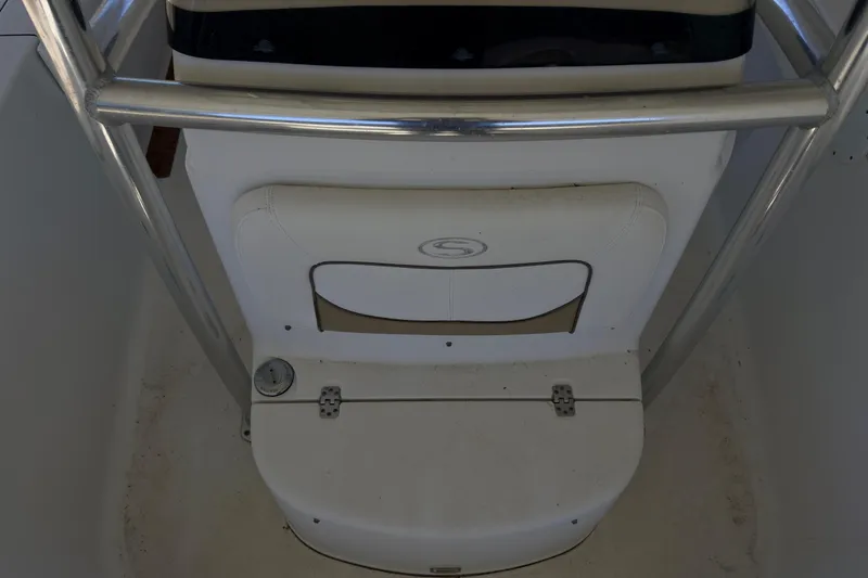 Slide: The Image of 2014 Sportsman Heritage 211 Center Console with Yamaha 150 outboard motor in a garage. - 41