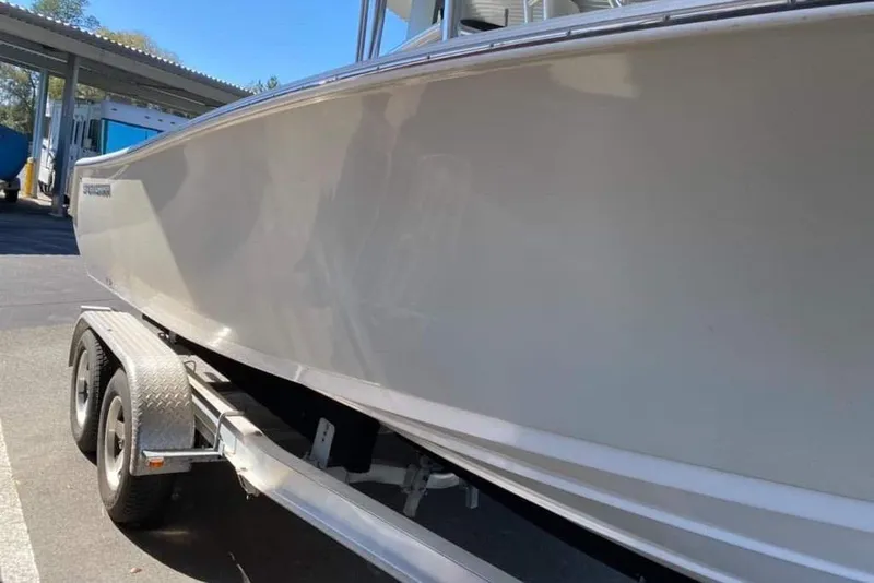 Slide: The Image of 2014 Sportsman Heritage 211 Center Console boat propeller close-up on trailer. - 6