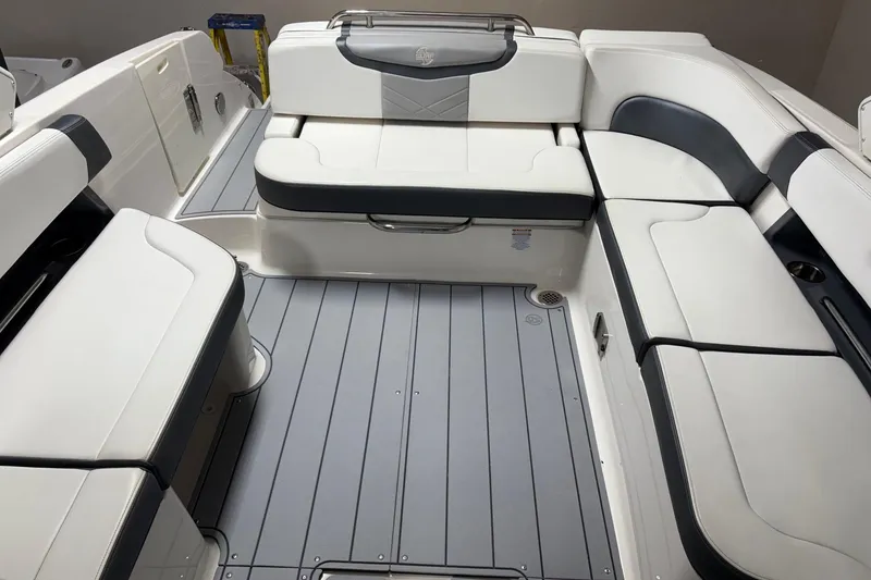 Slide: The Image of 2021 Chaparral 30 Surf boat interior with sleek white and gray seating arrangement. - 10