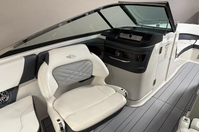 Slide: The Image of 2021 Chaparral 30 Surf boat interior with sleek seating and modern dashboard design. - 12