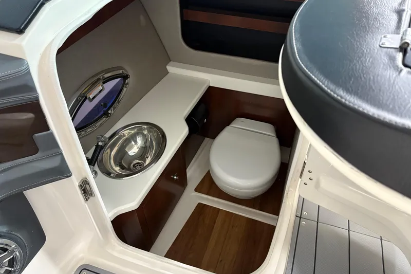 Slide: The Image of 2021 Chaparral 30 Surf boat interior with sink and toilet. - 13