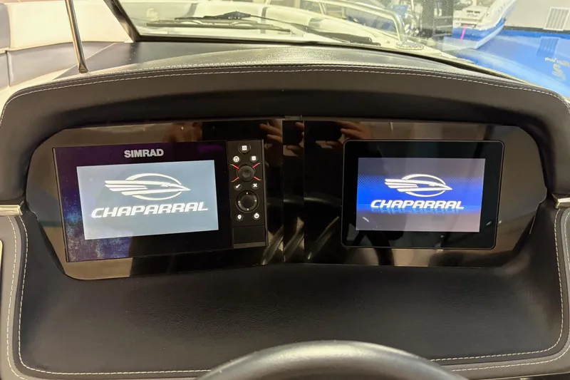 Slide: The Image of Dashboard of 2021 Chaparral 30 Surf boat with dual Simrad displays. - 16