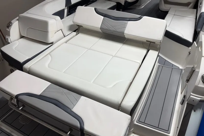 Slide: The Image of 2021 Chaparral 30 Surf boat interior with white and gray seating. - 8