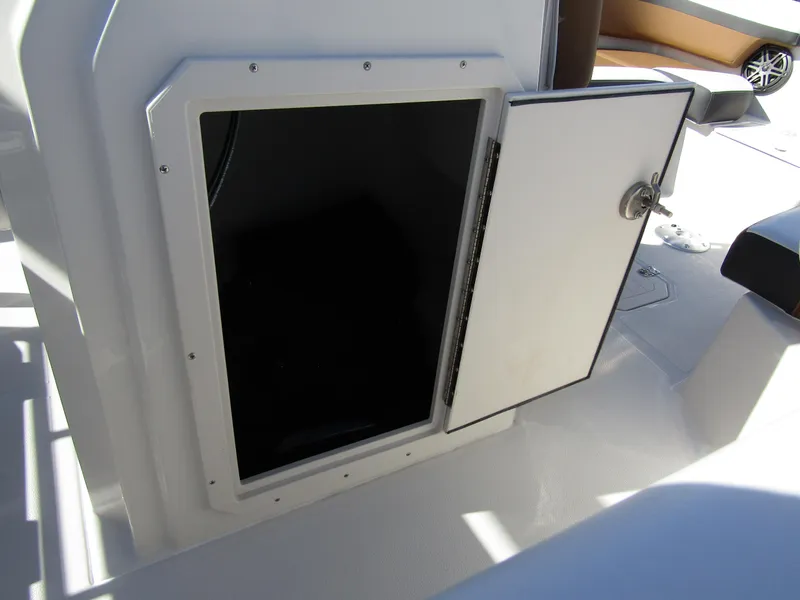 Slide: The Image of Open storage compartment on a 2024 Starcraft SVX 191 OB CC boat. - 21