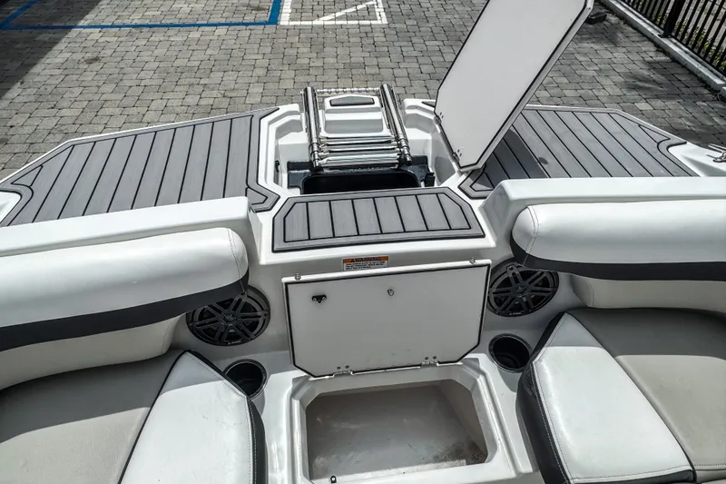 Slide: The Image of 2024 Starcraft SVX 211 OB boat interior with seating, storage, and speakers. - 17