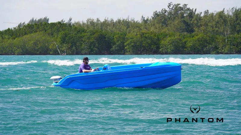 Slide: The Image of 2024 Vision Marine Technologies Phantom boat cruising on blue waters. - 7