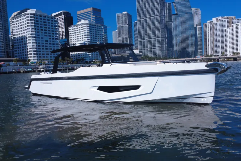 Slide: The Image of 2026 Fabbro F33 boat on water with city skyline background. - 0