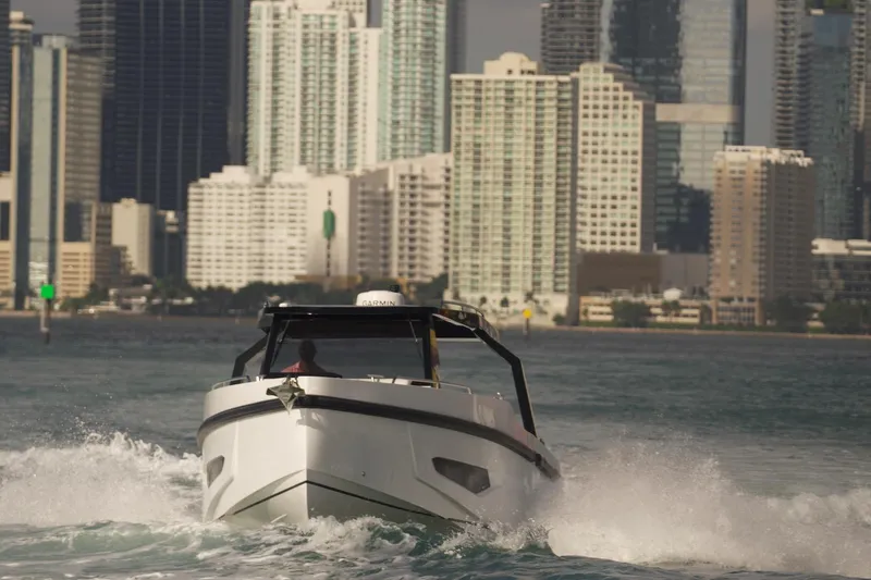 Slide: The Image of Fabbro F33 2026 boat with sleek white deck and cushioned seating. - 12