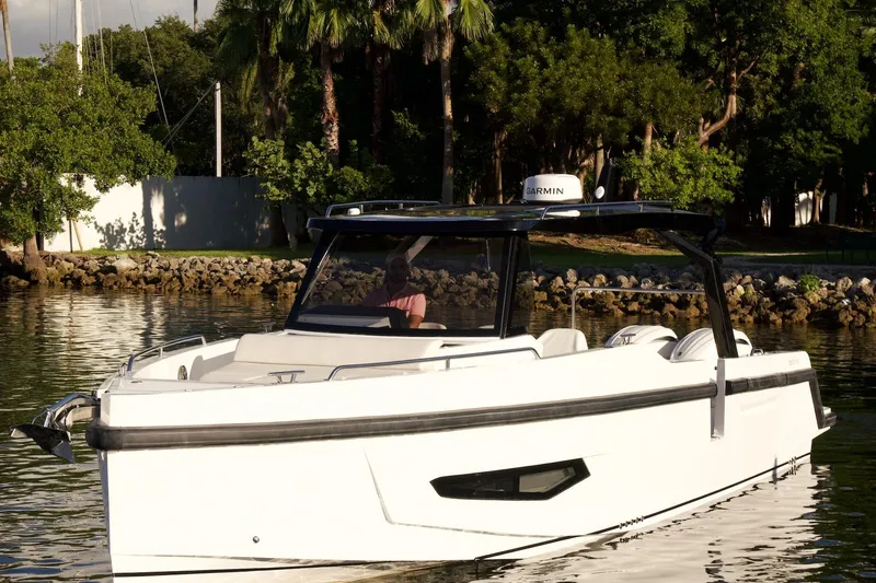 Slide: The Image of Fabbro F33 yacht, 2026 model, with logo, against a clear blue sky. - 13