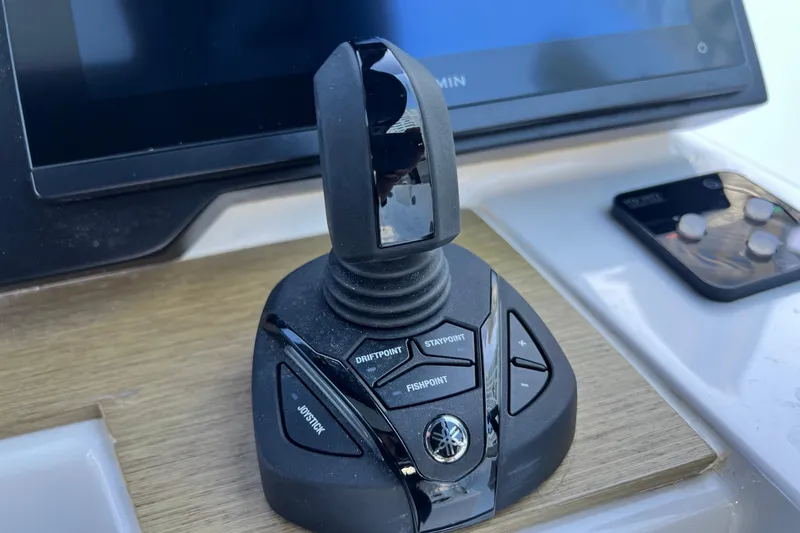 Slide: The Image of Joystick control panel on a 2026 Fabbro F33 boat, featuring various navigation buttons. - 17