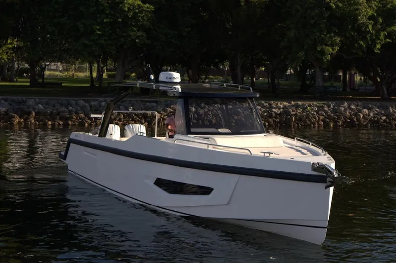 Slide: The Image of Fabbro F33 2026 motorboat on calm water. - 7