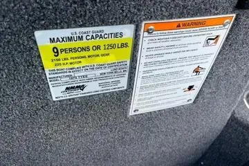 Slide: The Image of Interior of 2026 Lund 1975 Tyee boat, featuring seating and storage compartments. - 10