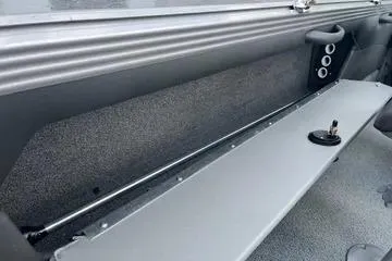 Slide: The Image of Interior of 2026 Lund 1975 Tyee boat, featuring sleek seating and modern design elements. - 11