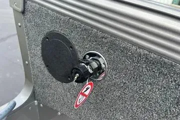 Slide: The Image of Interior of 2026 Lund 1975 Tyee boat with sleek seating and modern design. - 14