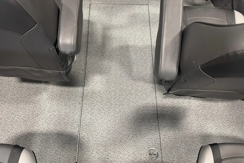 Slide: The Image of Interior of 2026 Lund 1975 Tyee boat with gray carpet and black seats. - 20