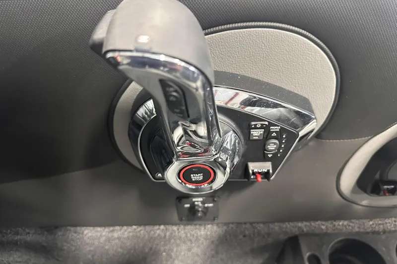 Slide: The Image of Control panel of 2026 Lund 1975 Tyee boat with start button and throttle controls. - 24