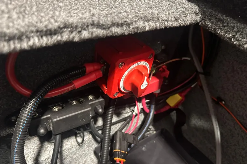 Slide: The Image of Electrical wiring and switch inside a 2026 Lund 1975 Tyee boat. - 28