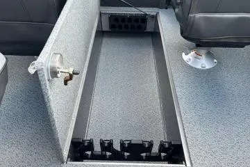 Slide: The Image of Interior of 2026 Lund 1975 Tyee boat with steering wheel and control panel. - 9