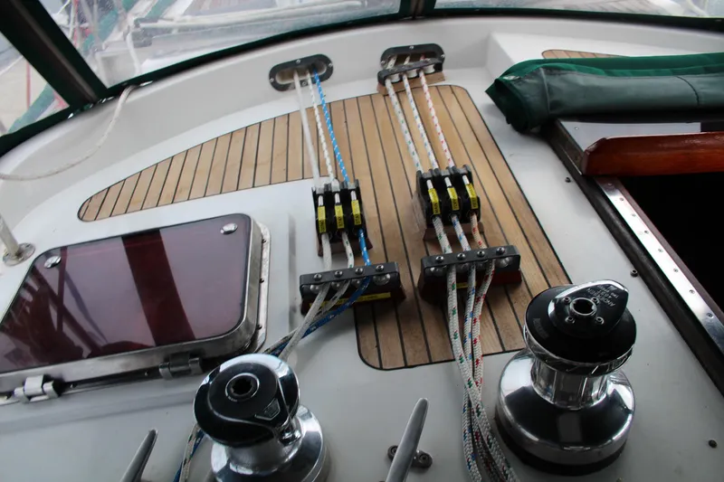 Slide: The Image of Cockpit of 1990 Slocum 43 sailboat with winches and rope clutches on teak deck. - 9