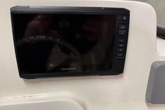 Slide: The Image of Garmin display on 2020 NauticStar 2302 Legacy Dual Console boat dashboard. - 11
