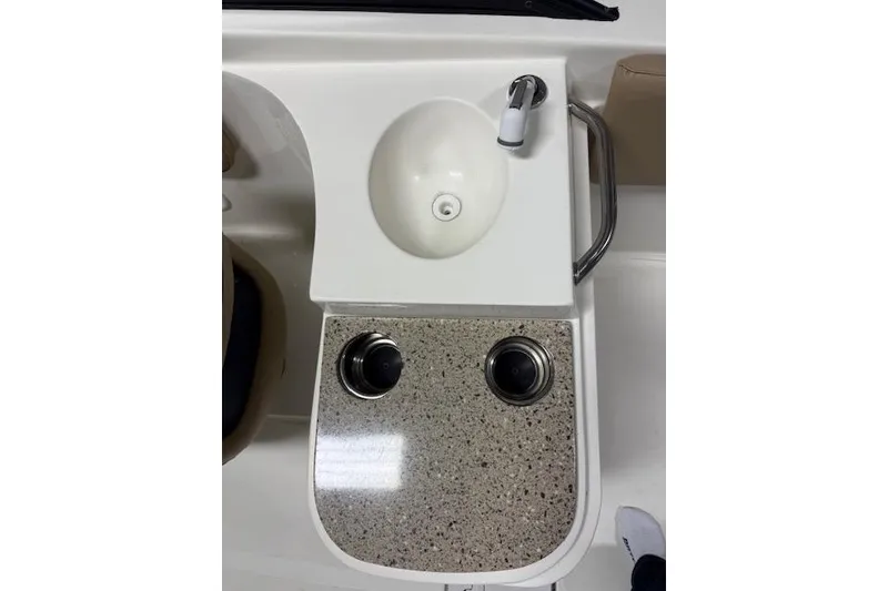 Slide: The Image of 2020 NauticStar 2302 Legacy Dual Console boat sink and countertop detail. - 22