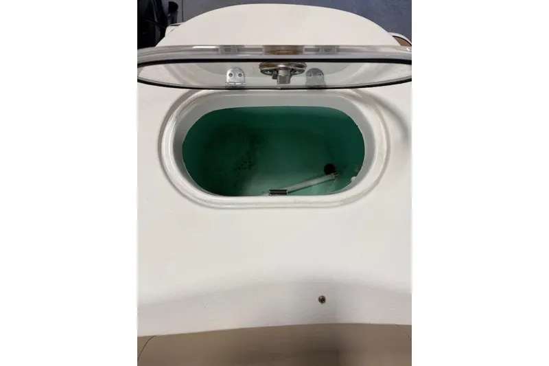 Slide: The Image of Livewell compartment on a 2020 NauticStar 2302 Legacy Dual Console boat. - 32