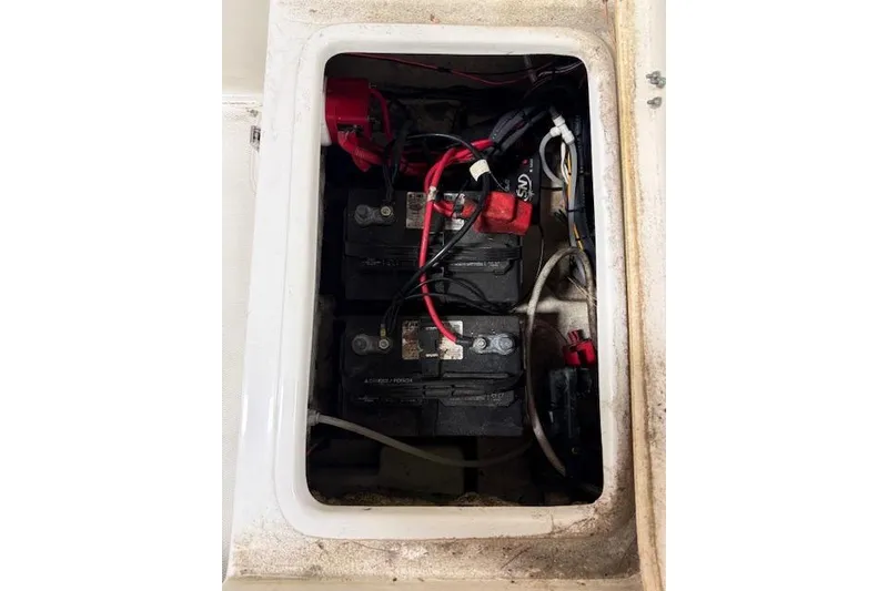 Slide: The Image of Battery compartment of 2020 NauticStar 2302 Legacy Dual Console boat. - 37