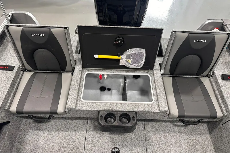 Slide: The Image of 2026 Lund 1775 Impact XS SS boat interior with seating and storage compartments. - 13