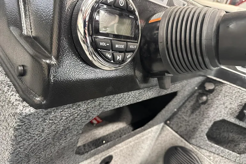 Slide: The Image of 2026 Lund 1775 Impact XS SS boat dashboard with control panel and steering components. - 19