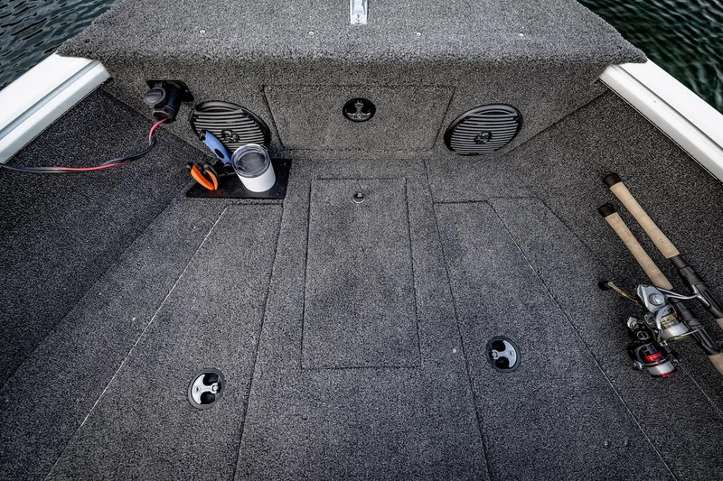 Slide: The Image of 2026 Lund 1775 Impact XS SS boat interior with four seats and steering console. - 9