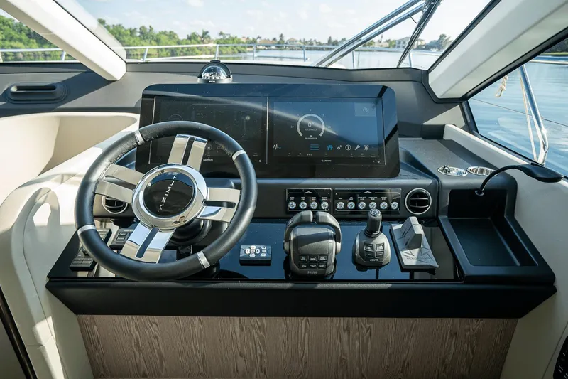 Slide: The Image of Helm of 2026 Azimut Fly 53 yacht with modern controls and navigation display. - 15