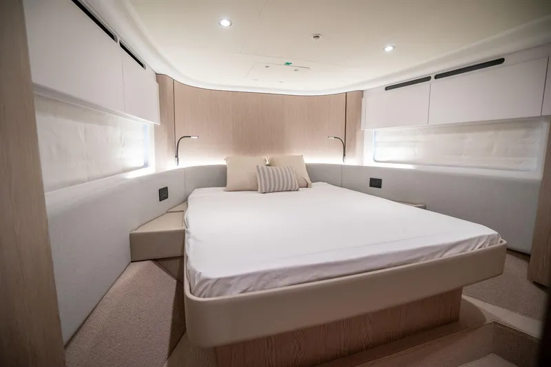 Slide: The Image of Luxurious bedroom interior of 2026 Azimut Fly 53 yacht, featuring modern design and ambient lighting. - 17