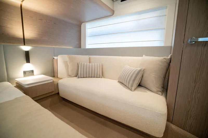 Slide: The Image of Luxurious interior of 2026 Azimut Fly 53 yacht with elegant sofa and cushions. - 25