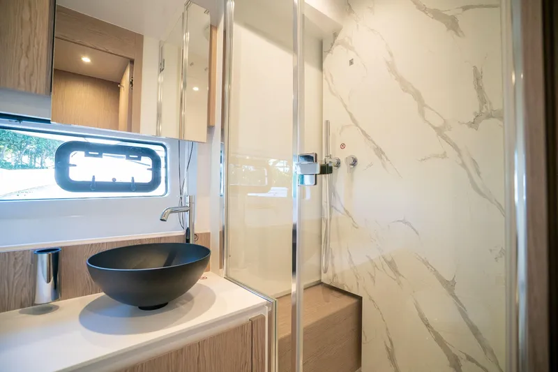 Slide: The Image of Luxurious bathroom in 2026 Azimut Fly 53 yacht with modern fixtures and marble accents. - 30