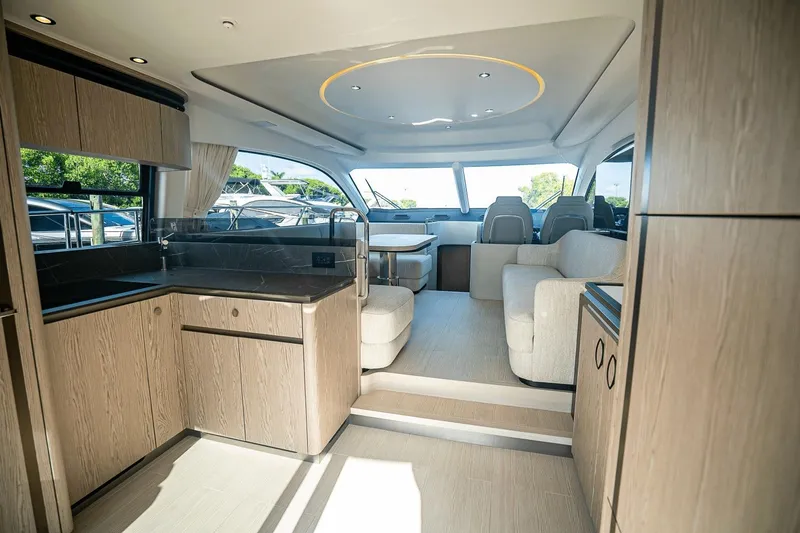 Slide: The Image of Luxurious interior of 2026 Azimut Fly 53 yacht with modern kitchen and seating area. - 7