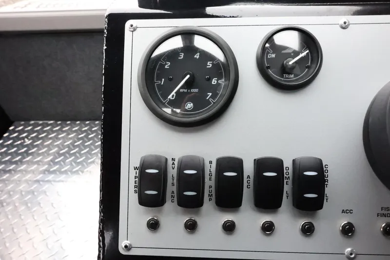 Slide: The Image of Control panel of 2026 Thunder Jet 210 Luxor Limited boat with gauges and switches. - 25